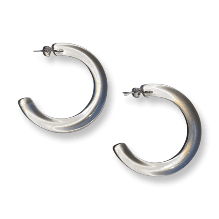 Pristine crystal clear acrylic hoop earrings: Sleek, large crystal clear hoop earrings showcasing a minimalist, transparent look.