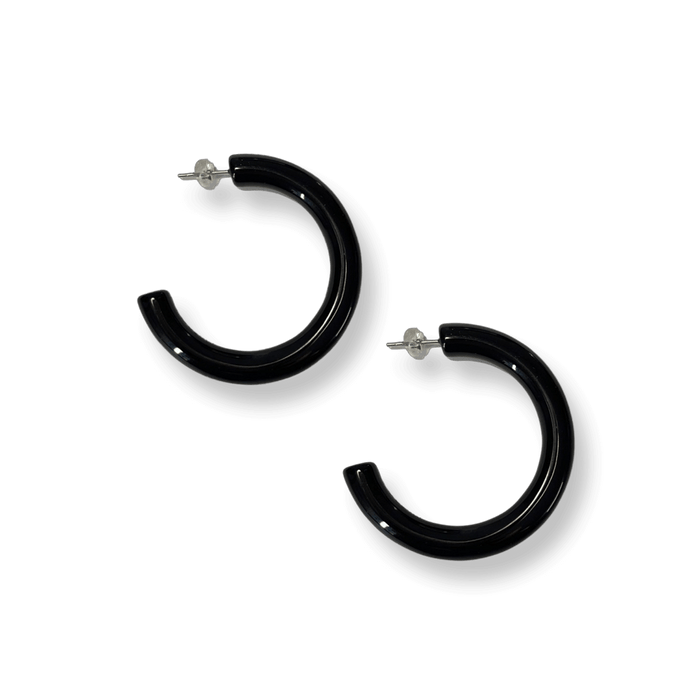 Jet black acrylic hoop earrings: Elegant, large jet black hoop earrings with a bold, eye-catching design.